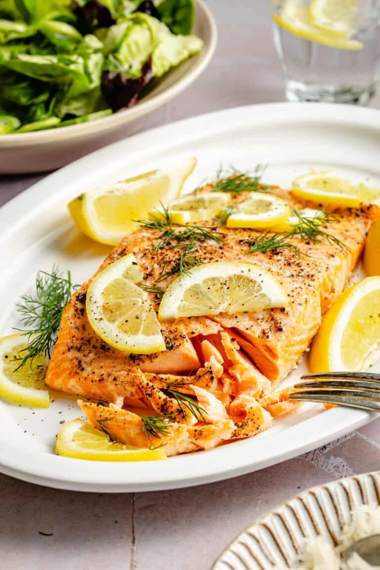 baked salmon on plate with lemon