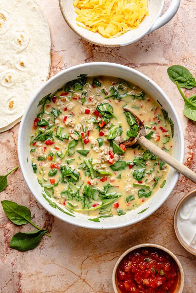sheet pan egg mixture in mixing bowl