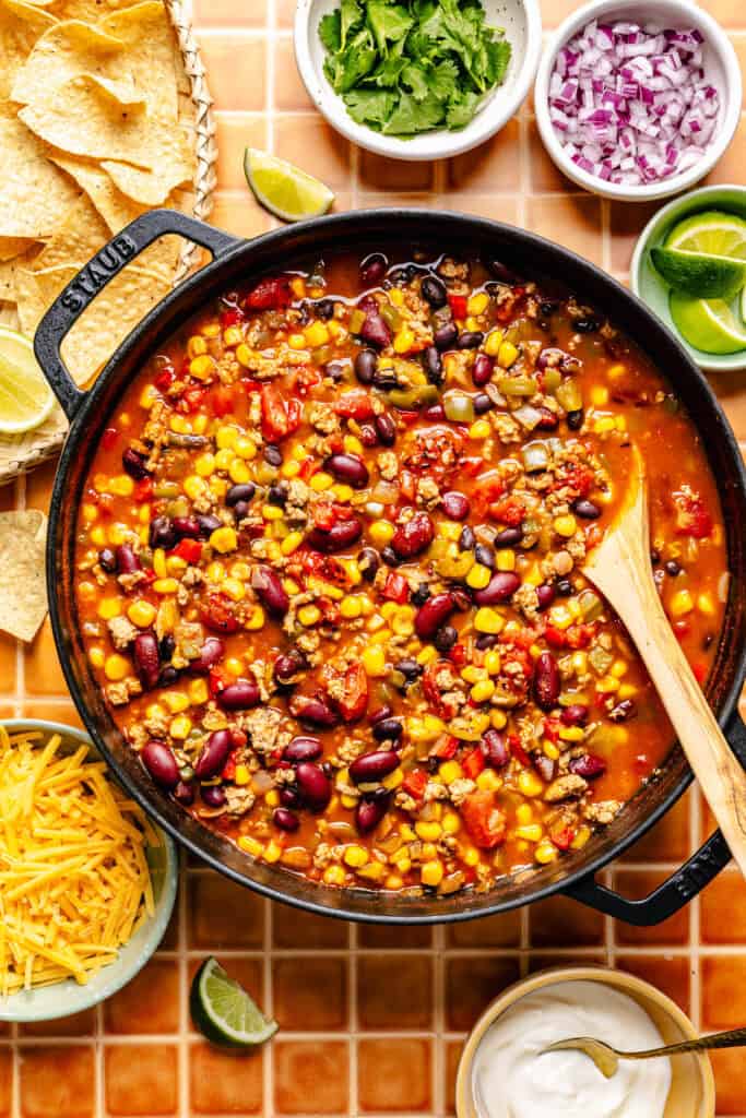 soup in pot with wooden spoon